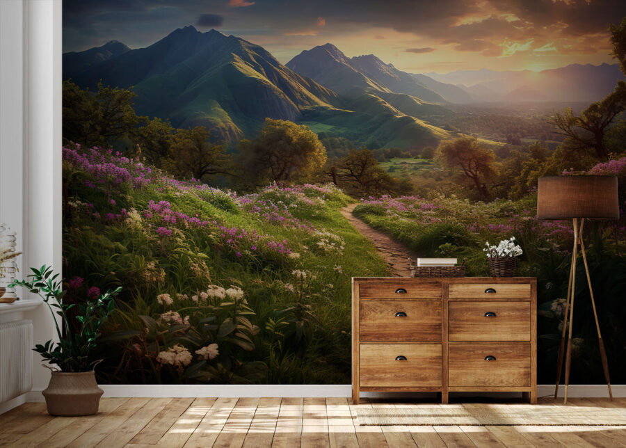 Path through a grassy area with flowers and mountains in the background