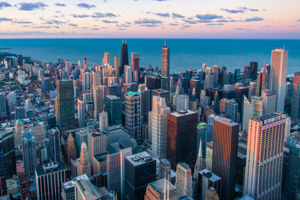 City with tall buildings and a body of water City with tall buildings and a body of water