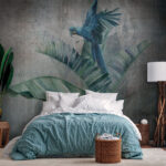 Wall murals Blue parrot on a banana leaf