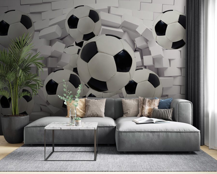 Group of football balls flying over a wall