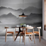 Wall murals Mountain range with fog and water