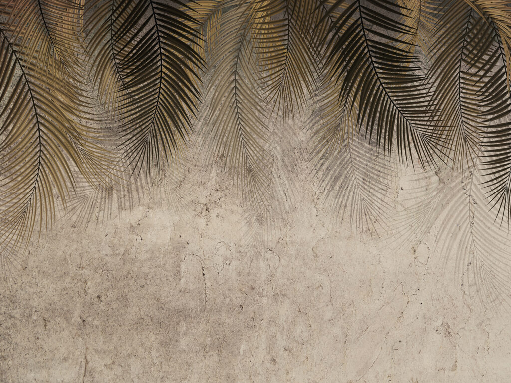 Palm leaves against a textured backdrop. Palm leaves against a textured backdrop.