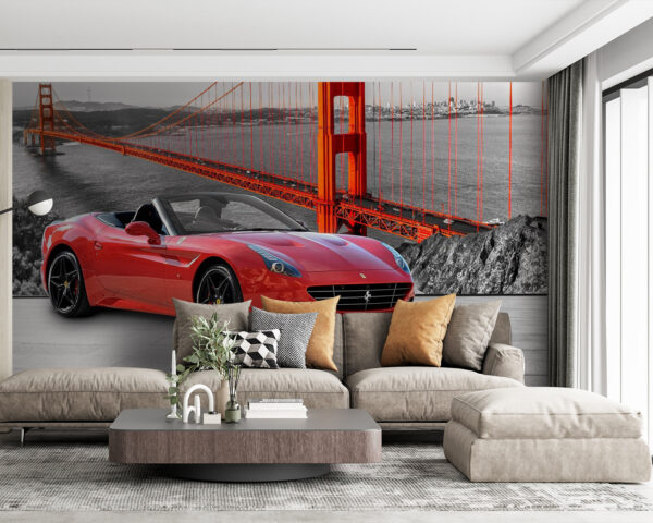 Red convertible car on a road with a bridge in the background