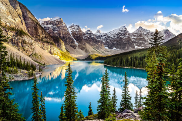 Lake surrounded by trees and mountains Lake surrounded by trees and mountains