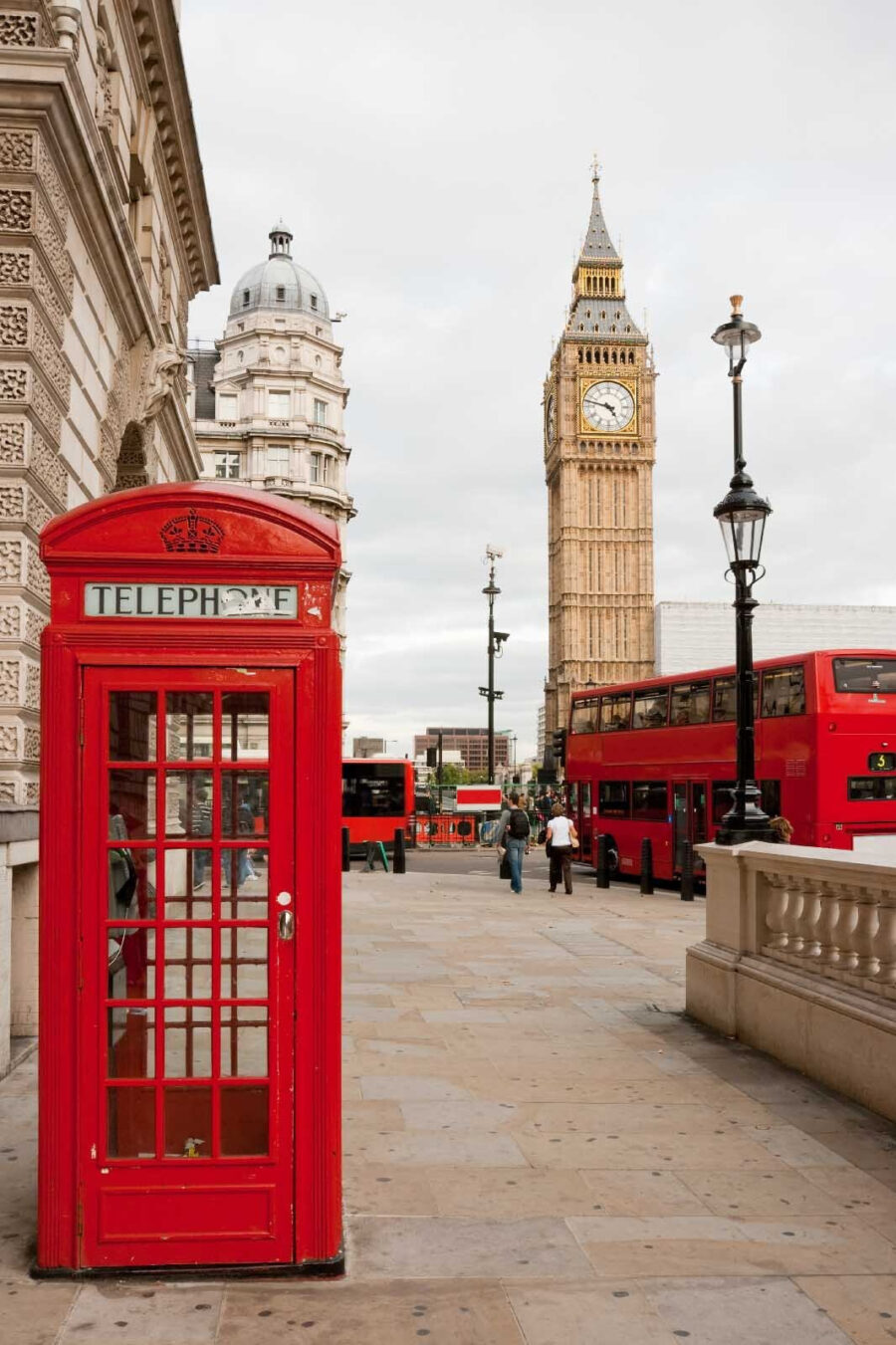 Red telephone booth in a city