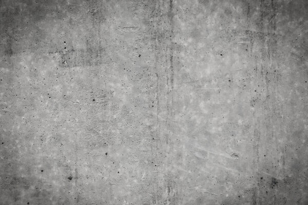 Grey concrete wall with black spots u55655p 600x400 - Grey concrete wall with black spots