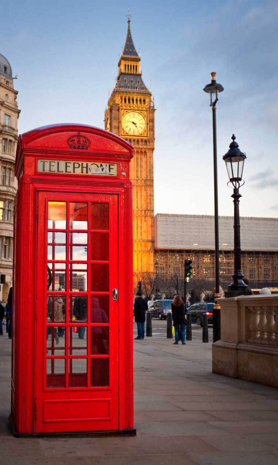 Red telephone booth in a city