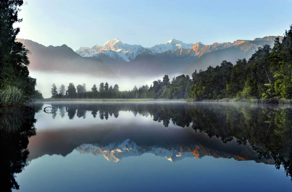 Lake with trees and mountains in the background u53417p 1024x675 - Lake with trees and mountains in the background - tegory