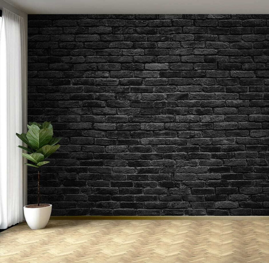 Black brick wall with a white spot