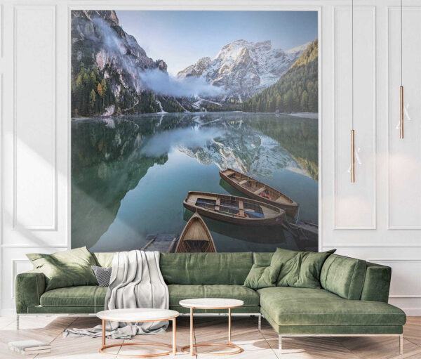Boats on a lake with mountains in the background Boats on a lake with mountains in the background