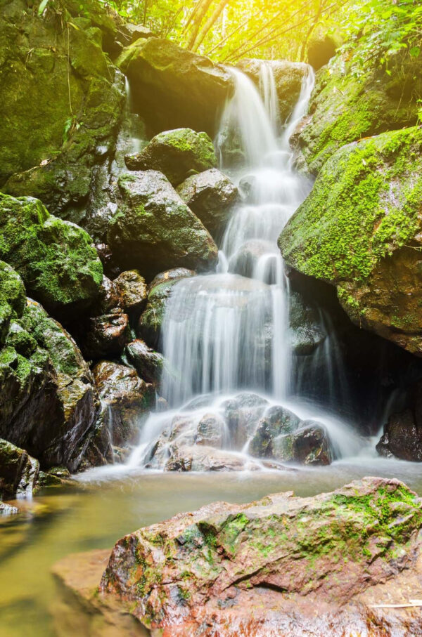 Waterfall over rocks with moss Waterfall over rocks with moss