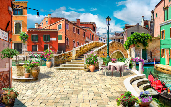 Patio with a table and chairs and a fountain in front of a building u18551p 600x375 - Patio with a table and chairs and a fountain in front of a building - tegory