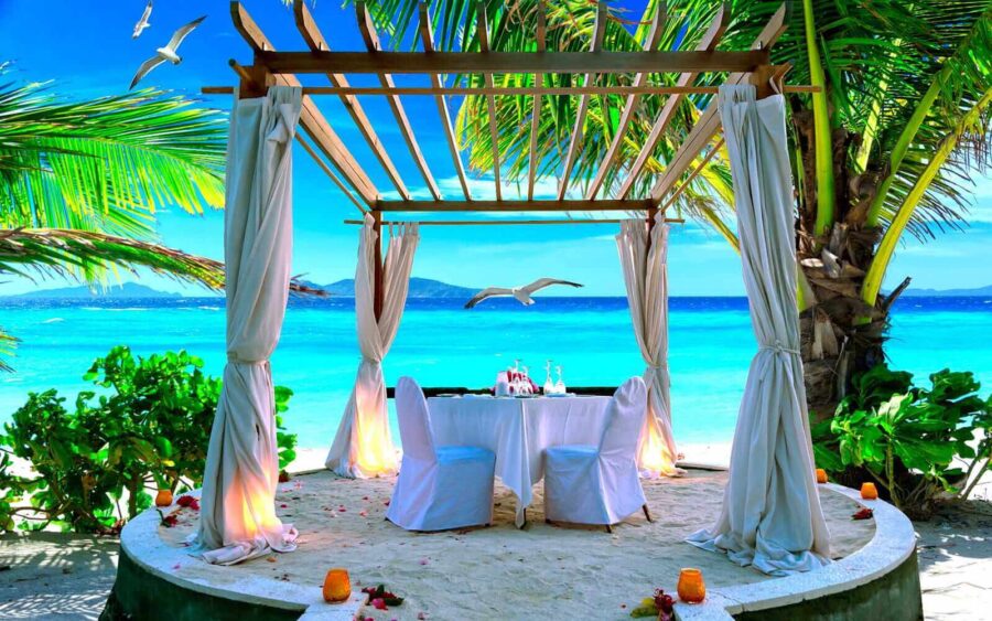 Wall murals Table set up on a beach - Image 6