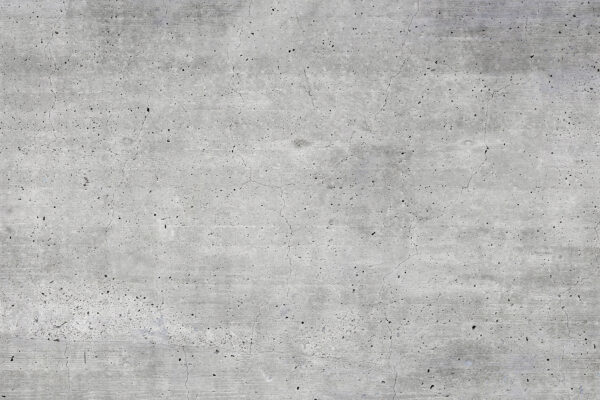 Grey concrete surface with small specks Grey concrete surface with small specks