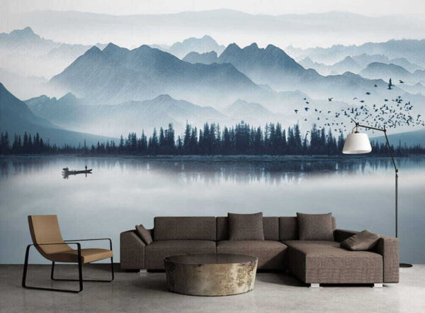 Person in a boat on a lake with mountains in the background Person in a boat on a lake with mountains in the background