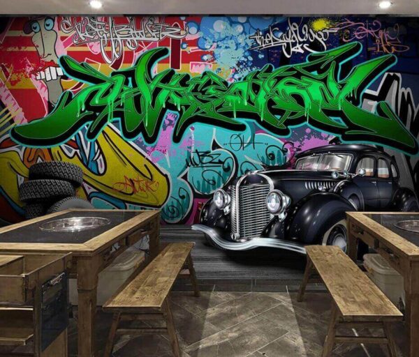 Black car with wheels in front of a colorful wall u01706piz1m 600x512 - Black car with wheels in front of a colorful wall - tegory