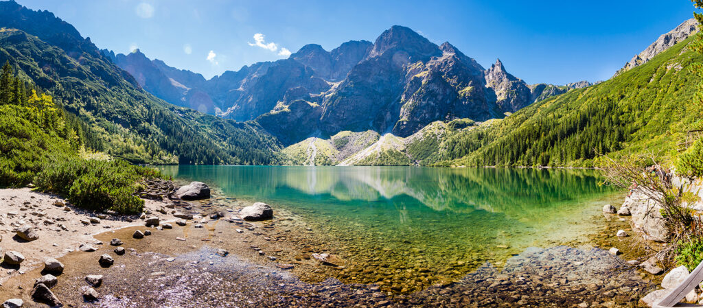 Lake with mountains in the background Lake with mountains in the background
