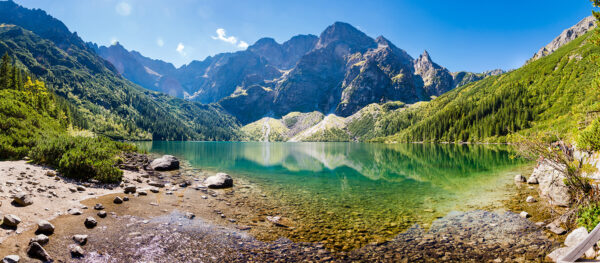 Lake with mountains in the background Lake with mountains in the background