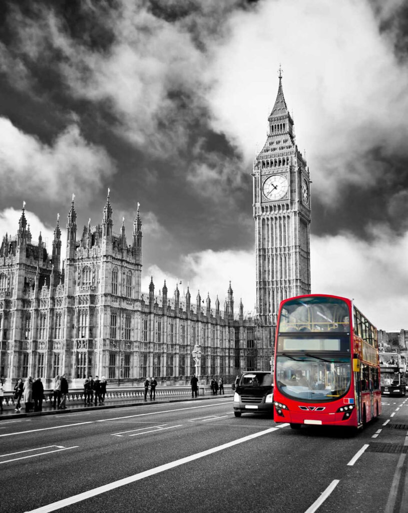 Red double decker bus on a street with a clock tower in the background u56834p 815x1024 - Red double decker bus on a street with a clock tower in the background - tegory