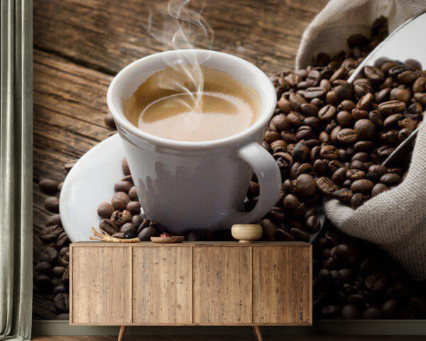 Cup of coffee on a saucer with coffee beans Cup of coffee on a saucer with coffee beans