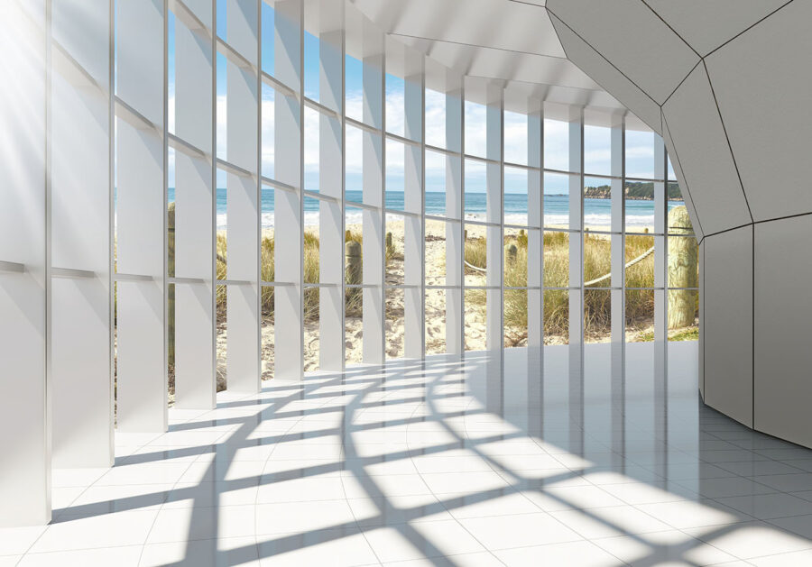 Large room with windows and a beach view