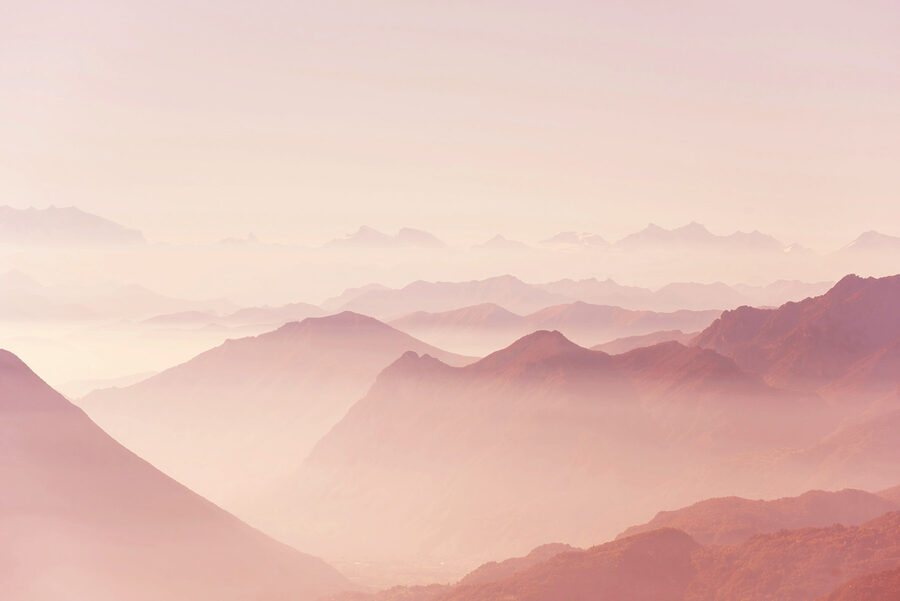 A mountain range with fog