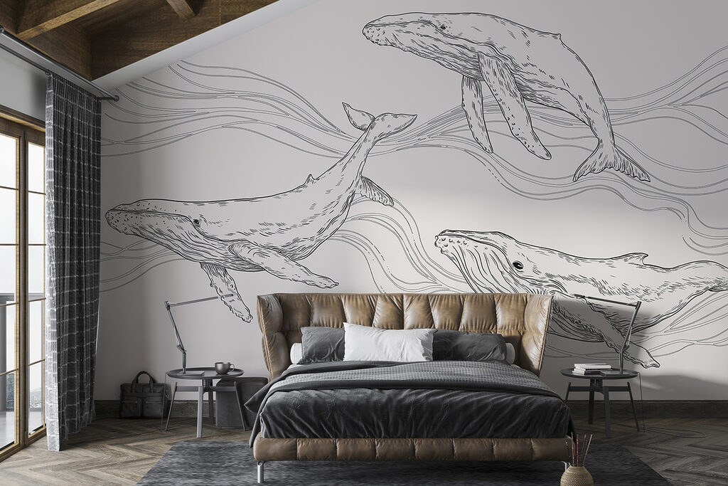 A group of whales swimming in the water