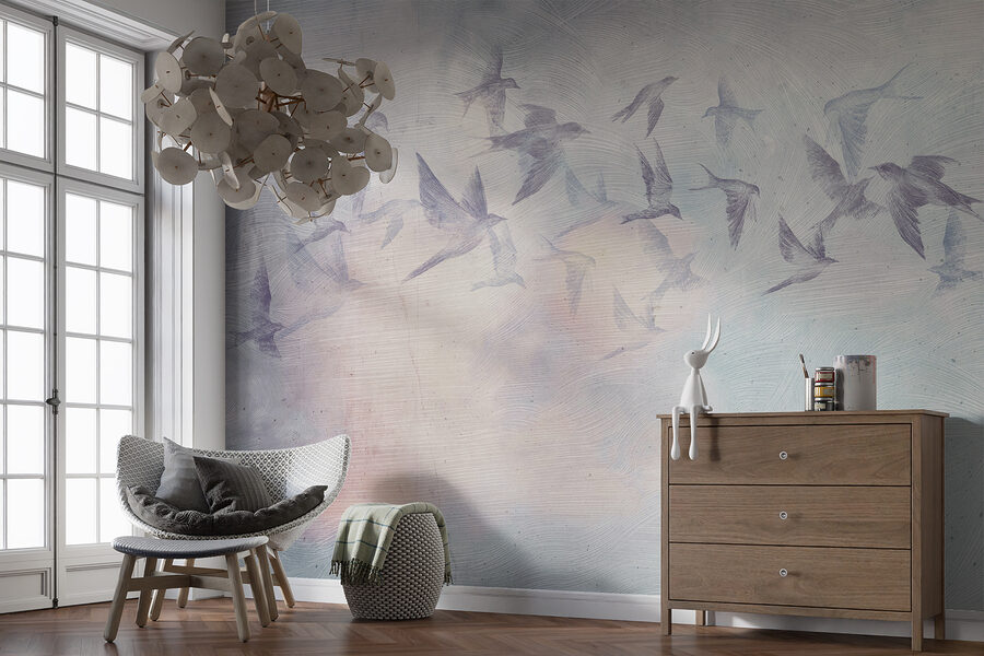 A flock of birds flying in the sky