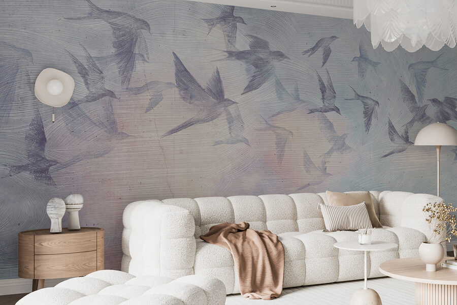 A flock of birds flying in the sky