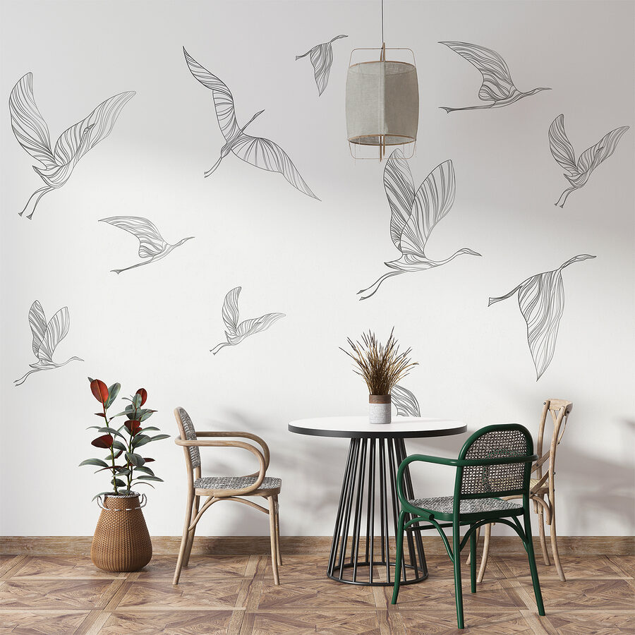 A group of birds flying A group of birds flying