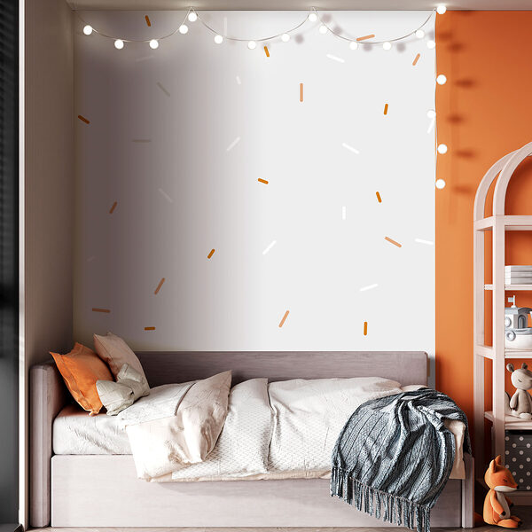 A white and orange sprinkles on a gray background A white and orange sprinkles on a gray background
