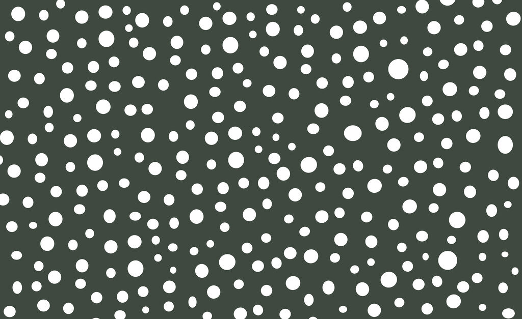 White dots on a green background White dots on a green background