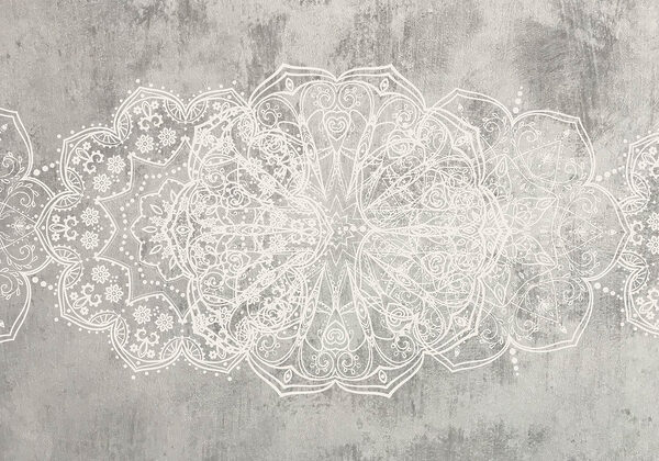 White ornate design on a grey surface White ornate design on a grey surface