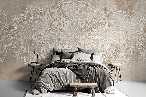White ornate design on a brown surface White ornate design on a brown surface