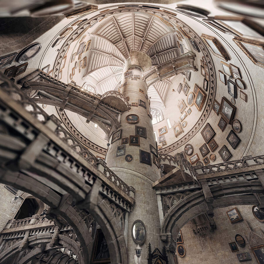 Circular building with multiple staircases and pictures on the walls