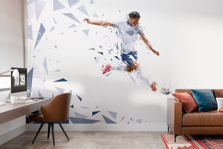 Man kicking a football ball Man kicking a football ball