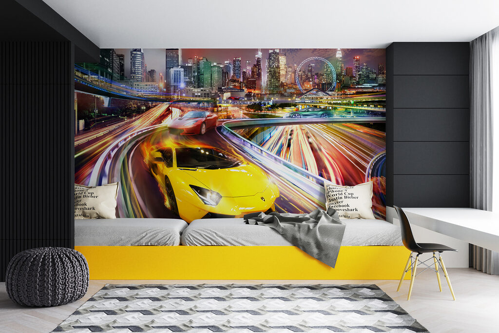 Yellow and red sports cars on a road with a city in the background Yellow and red sports cars on a road with a city in the background