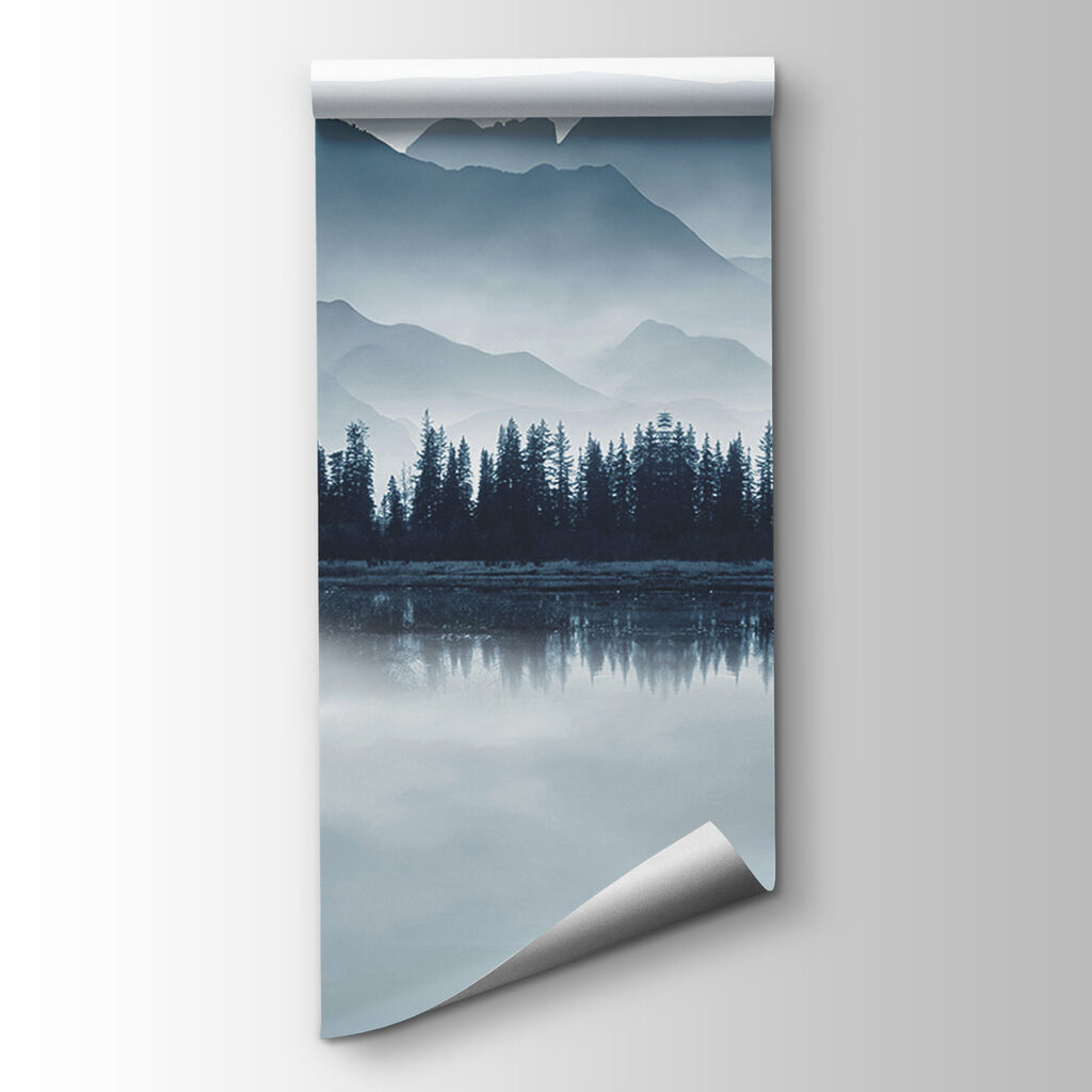 Person in a boat on a lake with mountains in the background