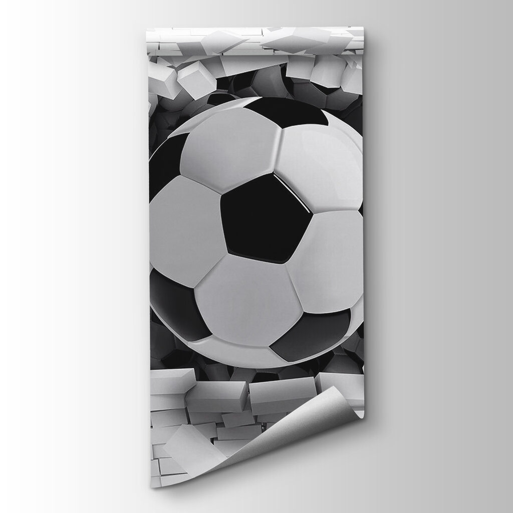 Football ball breaking through a brick wall