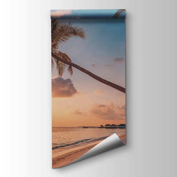 A beach with palm trees and a body of water A beach with palm trees and a body of water