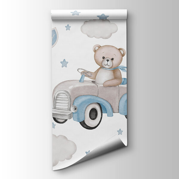 Teddy bear driving a car with balloons